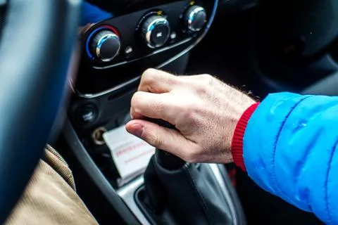 Changing car 's gear manually with right hand Stock Photos