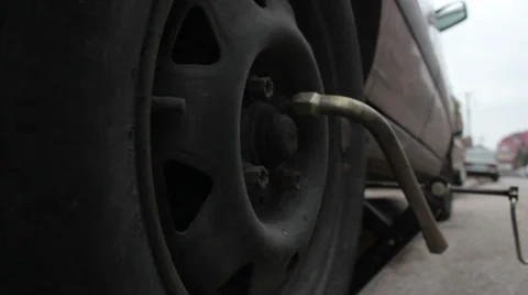 Changing a car tire Stock Footage 32862827