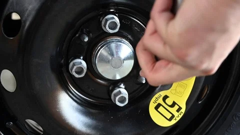 Changing the car tire Stock Footage 121229035