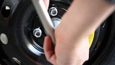 Changing the car tire Stock Footage 121229314