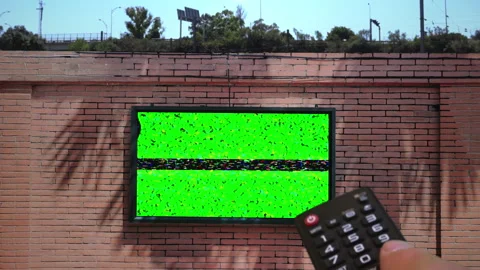 Changing Channels Green Screen TV Display on Brick Wall Set Stock Footage 318612863