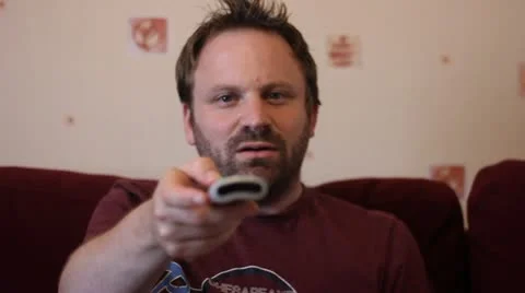 Changing channels with remote Stock Footage 20601695