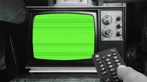 Changing Channels TV Remote Control Green Screen Vintage Television Stock Footage 98240646