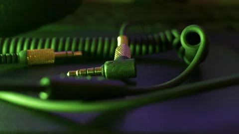 Changing colored lights over stereo input audio connector and tangled Stock Footage 147175058