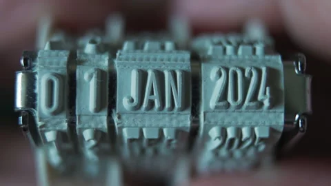Changing the date on a rubber stamp from December 31, 2023 to January 1, 2024 Stock Footage 259821325