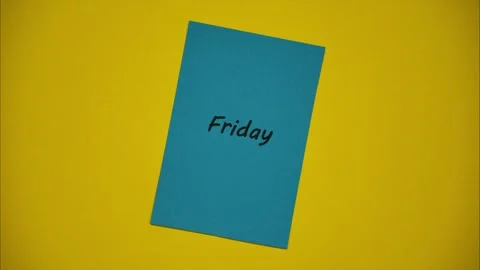 Changing days of the week on colored stickers on a yellow background Vídeos de archivo 297409806