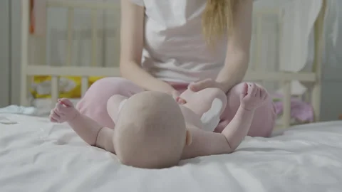 Changing Diaper on baby 2 Stock Footage 264579387