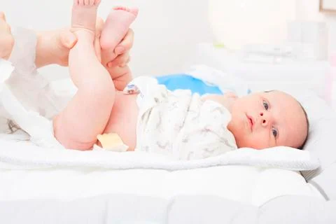 Changing the diaper of a newborn Stock Photos