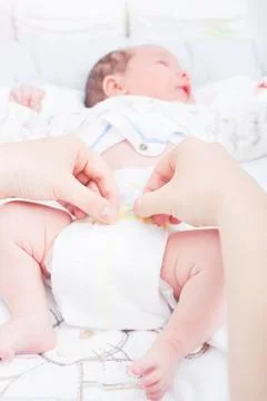 Changing the diaper of a newborn Stock Photos