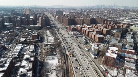 Changing Drone Perspective Above Queens Highway and Winter Apartments Stock Footage 345943108