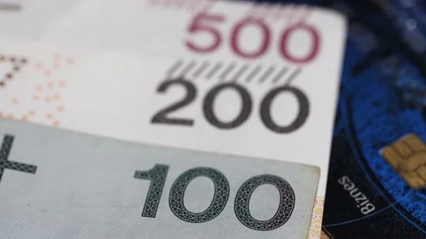 Changing focus on Polish banknotes from 100 PLN, 200 PLN till 500 PLN Video stock 168013915