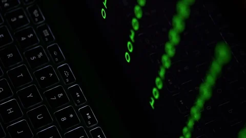 Changing green binary code on a laptop screen. Video stock 71775360