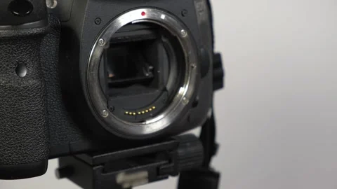 Changing the lens on the camera, preparing the equipment for filming Stock Footage 265012399