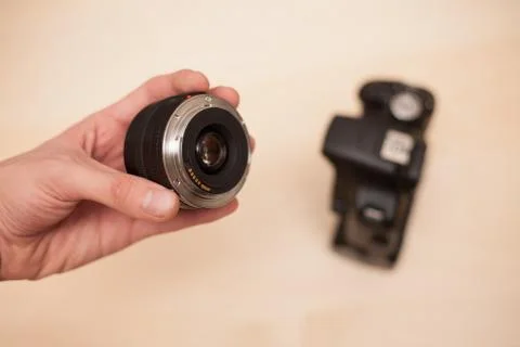 Changing lens on digital camera Stock Photos