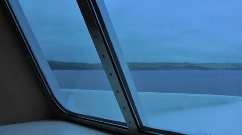 Changing light through ferry window sailing to Ireland Stock Footage 35837078