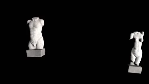 Changing lighting when moving antique torsos on a black background. Seamless Stock Footage 155529676