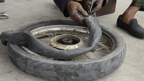 Changing motorcycle tire. Stock Footage 77749096