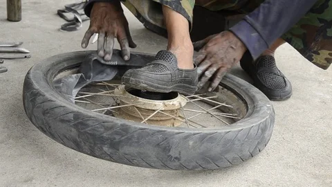 Changing motorcycle tire. Stock Footage 77749175