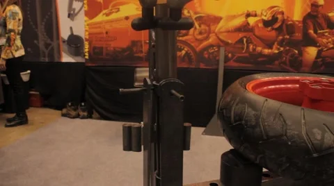 Changing a Motorcycle Tire on a Machine Stock Footage 41932185