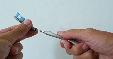 Changing new toothbrush nozzles. Close-up. Stock Footage 220465071
