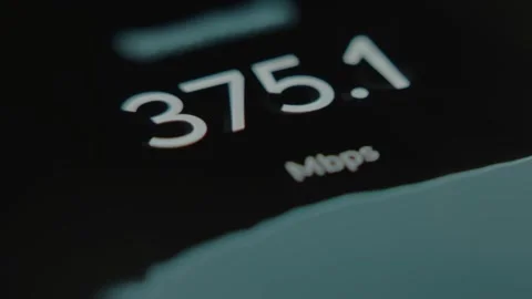 Changing numbers showing the Internet speed in Mbps during a test on a 스톡 동영상 291527042