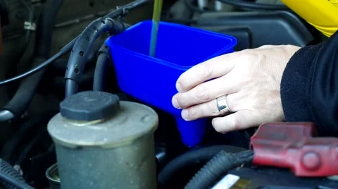 Changing the oil in a car engine Stock Footage 43739901