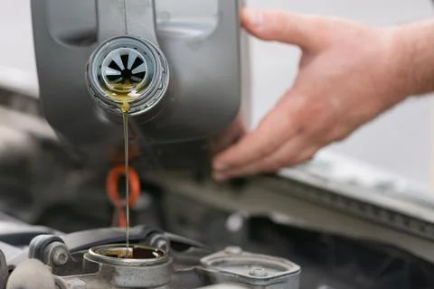 Changing the oil in a car engine. Stock Photos