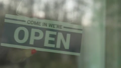 Changing Open Sign to Closed Stock Footage 249974780