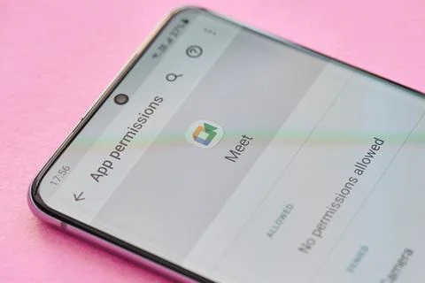 Changing permissions setting of google meet app Stock Photos
