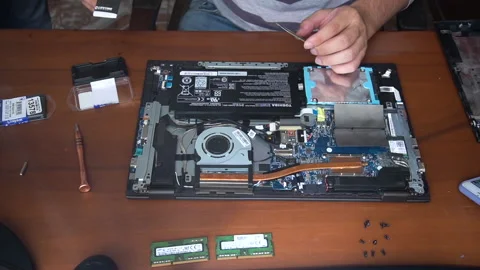 Changing ram memory to toshiba laptop top view Stock Footage 147459633