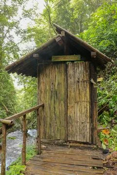 Changing room built of bamboo trunks by a river in a tropical rain forest. Sm Stock Photos