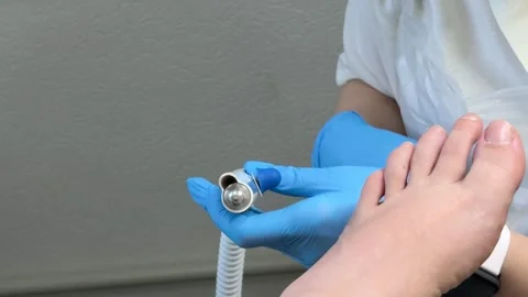 Changing rotary drill bit on electric nail file for professional pedicure Stock Footage 345176764
