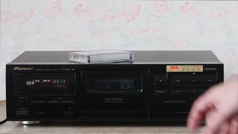 Changing the side of the audio cassette and rewinding Stock Footage 88947197