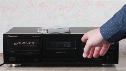 Changing the side of the audio cassette Stock Footage 88946816