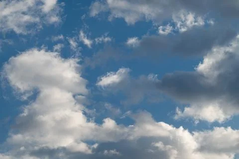 Changing sky with dark clouds. Fierce clouds indicating approaching storm system Stock Photos