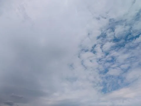 Changing sky with grey and white clouds above Mount Vernon, New York Stock Photos