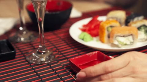 Changing soy sauce dish at sushi restaurant table close-up. Stock Footage 345447728
