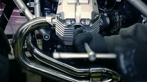 Changing spark plug with a wrench in motorcycle Stock-Footage 21378040