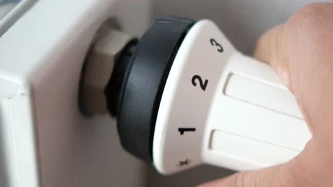 Changing temperature on heating radiator Video stock 233379891