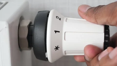 Changing temperature on heating radiator Video stock 243546604