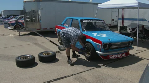 Changing tire 4 Stock Footage 49616850