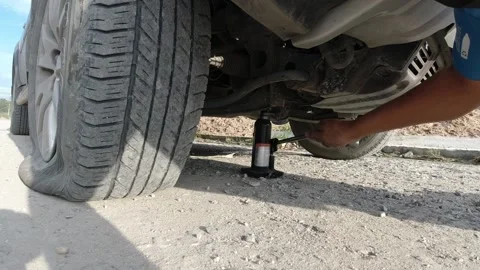 Changing the tires of  the side of the road. Stock Footage 153795629