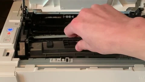 The changing of toner inside a household printer along with a look at the Stock Footage 138421187