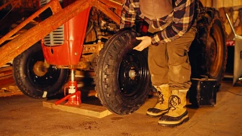 Changing Tractor Tire Stock Footage 337982228