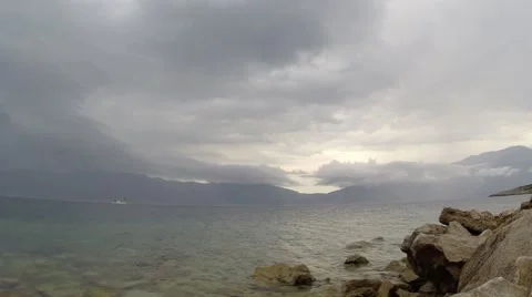 Changing weather in the mountains over the sea Stock Footage