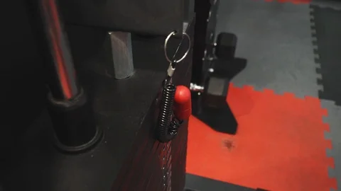 Changing weights on plates of gym machine Stock Footage 117910396