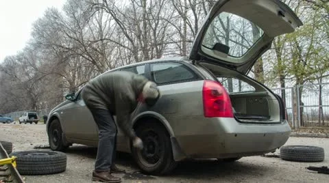 Changing wheels Stock Footage 12590537