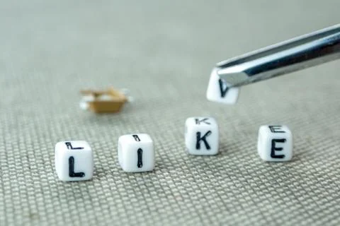 Changing white cube with letter k in the word like creating new word live on  Stock Photos