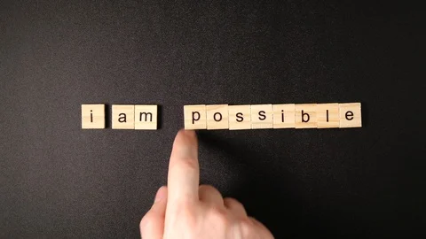 Changing words "Impossible" to "I'm possible" by hand 스톡 동영상 88264215