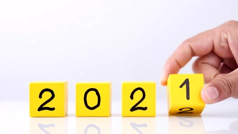 Changing year end 2021 to 2022. Close-up hand turns wooden cubes block Stock Footage 164104739